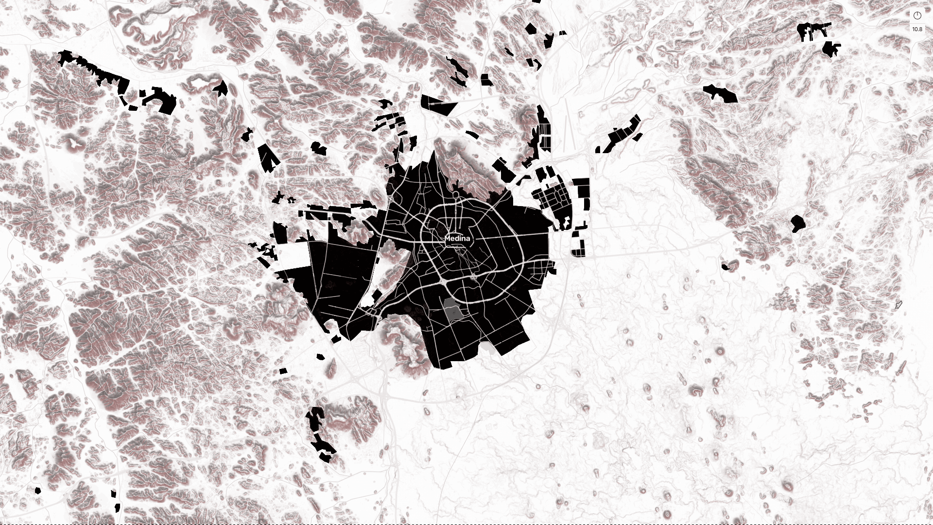 Carte stylisée de Médine montrant le centre urbain noir entouré de reliefs montagneux brun-rougeâtre.